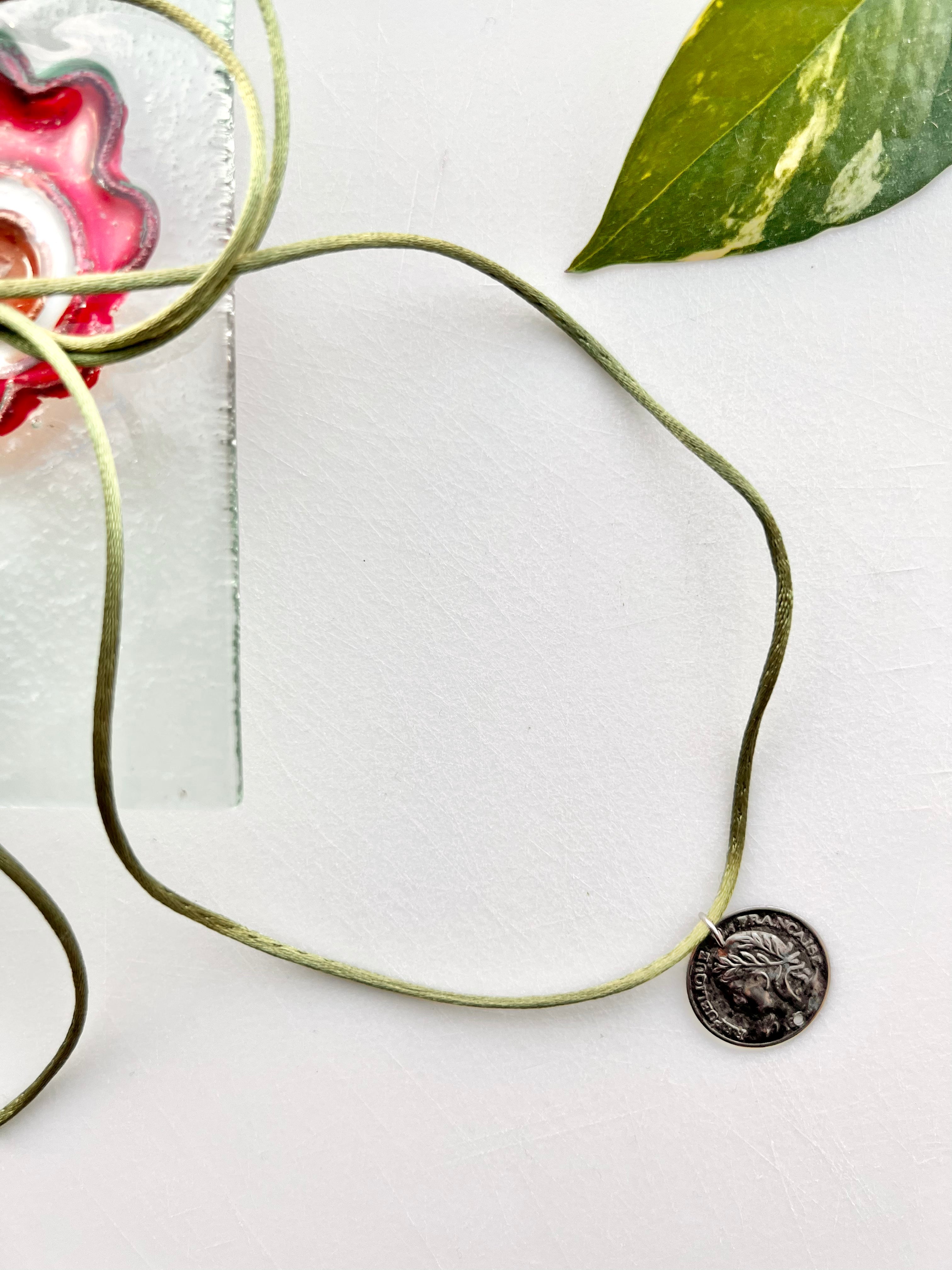 French Coin Pendant Choker On Charmeuse Green Tie Cord