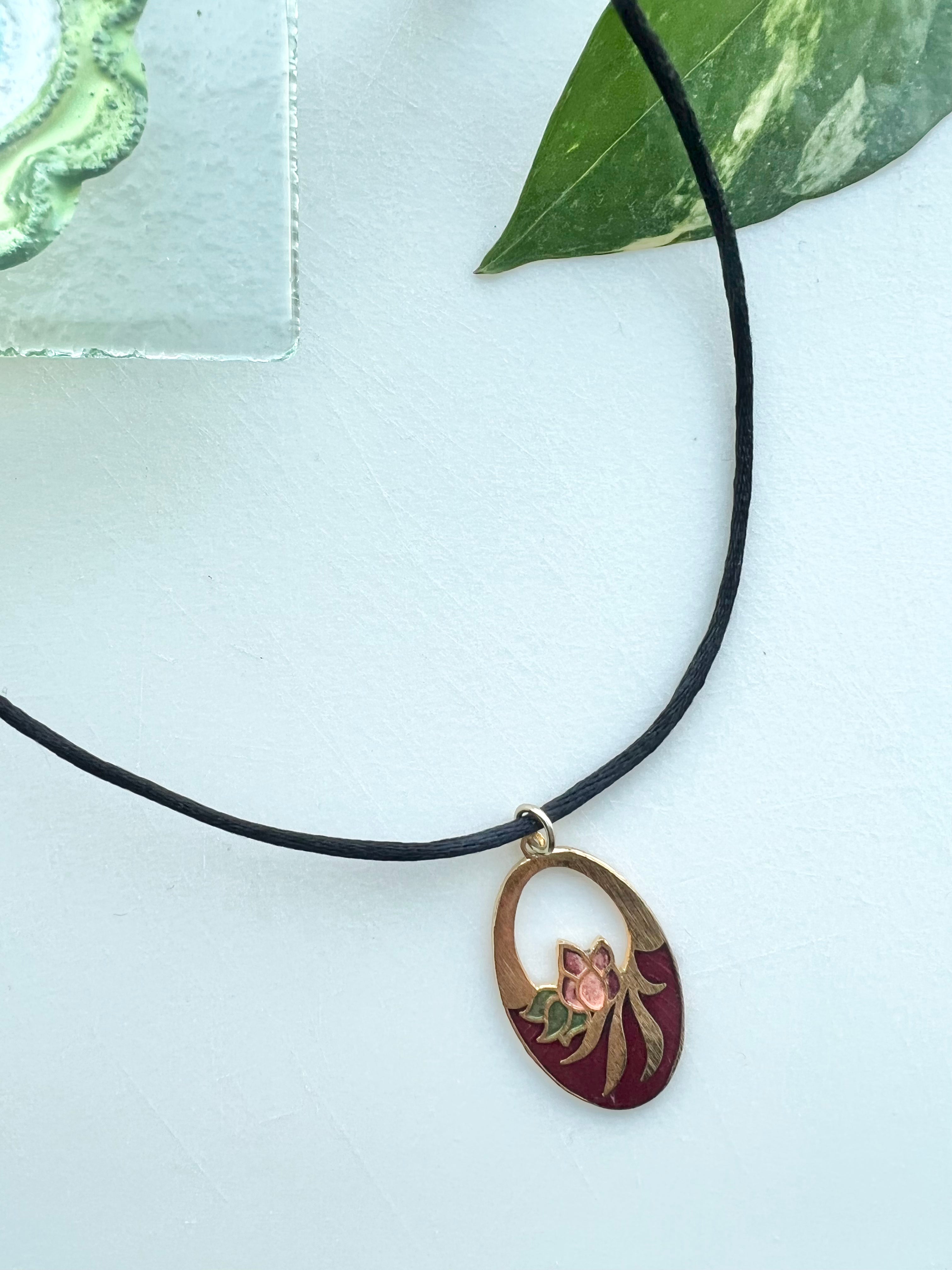 Ruby Oval Pendant Choker With Cutout Floral Design Strung On Satin Cord